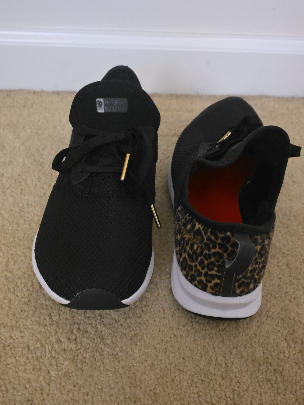 New Balance Black Athletic Sneakers with Leopard Heel Accent